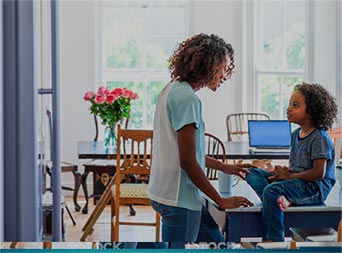 mom and child sitting in warm kitchen